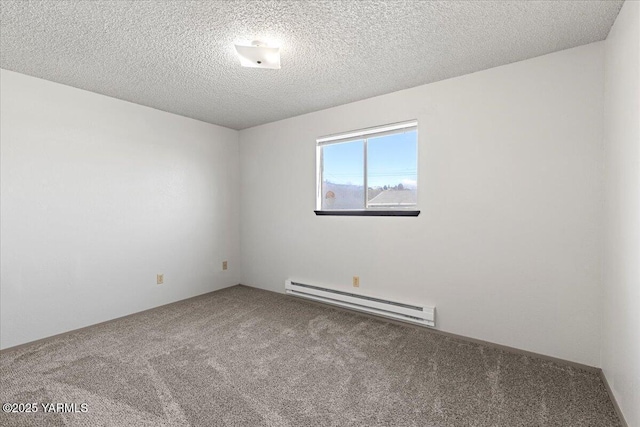 empty room with carpet floors, baseboard heating, and a textured ceiling