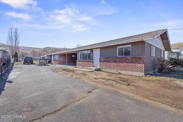 ranch-style house with brick siding