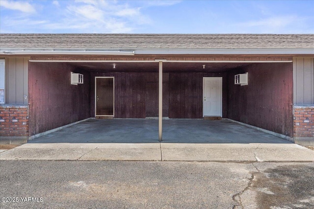 garage featuring a wall mounted air conditioner