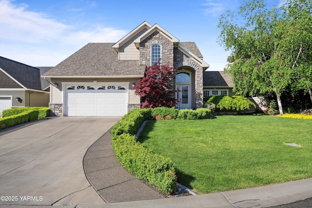 8704 Meadow Ln, Yakima, WA 98908 - view of front facade featuring stone siding, an attached garage, a front yard, and driveway