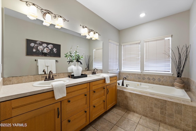 8704 Meadow Ln, Yakima, WA 98908 - bathroom with tile patterned flooring, a bath, and double vanity