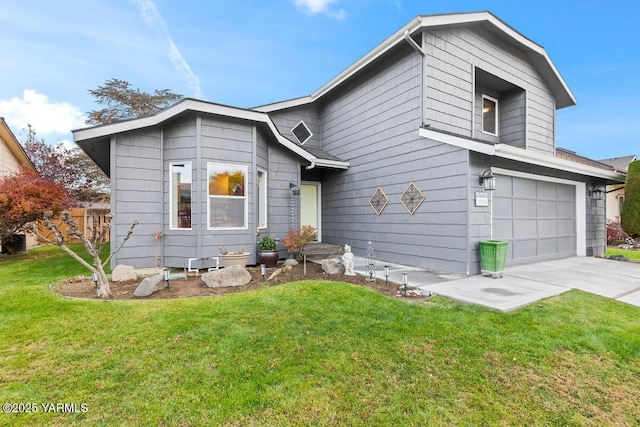 view of front of house with a front lawn, driveway, and an attached garage