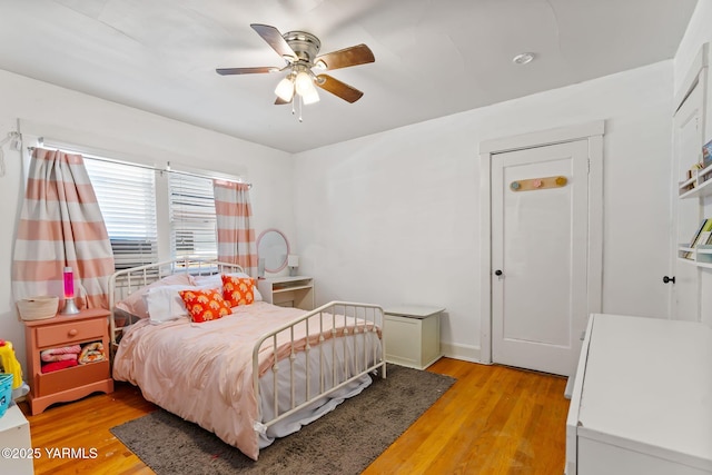 319 S 14th Ave, Yakima, WA 98902 - bedroom with light wood-style floors, a ceiling fan, and baseboards