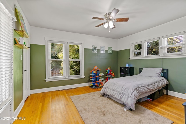 319 S 14th Ave, Yakima, WA 98902 - bedroom featuring wood finished floors, baseboards, and a ceiling fan