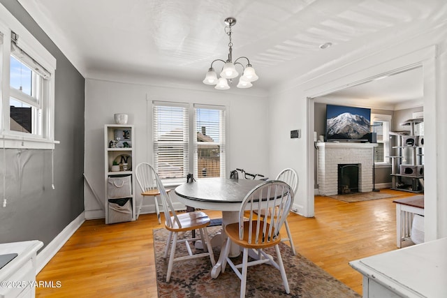319 S 14th Ave, Yakima, WA 98902 - dining space featuring a chandelier, plenty of natural light, and light wood finished floors