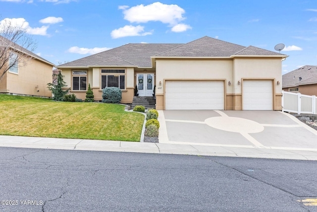 607 N 74th Ave, Yakima, WA 98908 - view of front of property with fence, a garage, a front lawn, stucco siding, and french doors