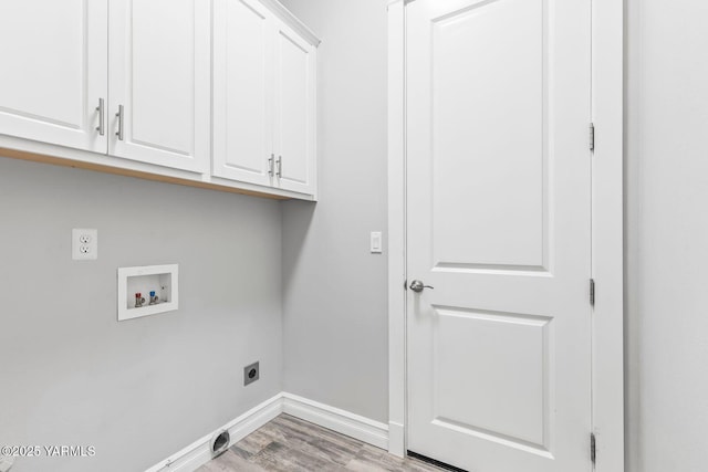 607 N 74th Ave, Yakima, WA 98908 - clothes washing area with hookup for a washing machine, baseboards, light wood-style flooring, cabinet space, and electric dryer hookup