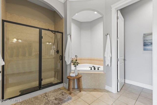 607 N 74th Ave, Yakima, WA 98908 - bathroom with a bath, tile patterned flooring, and a shower stall