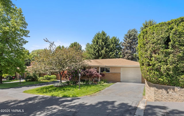 7610 Summitview Ave # 1, Yakima, WA 98908 - view of front of property with concrete driveway, brick siding, a garage, and a front yard