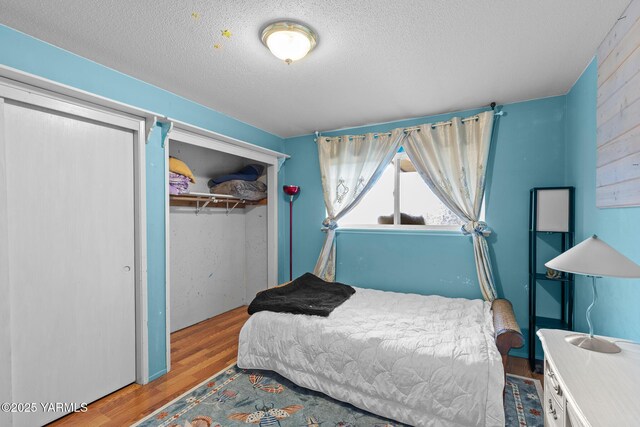 7610 Summitview Ave # 1, Yakima, WA 98908 - bedroom featuring wood finished floors, a closet, and a textured ceiling