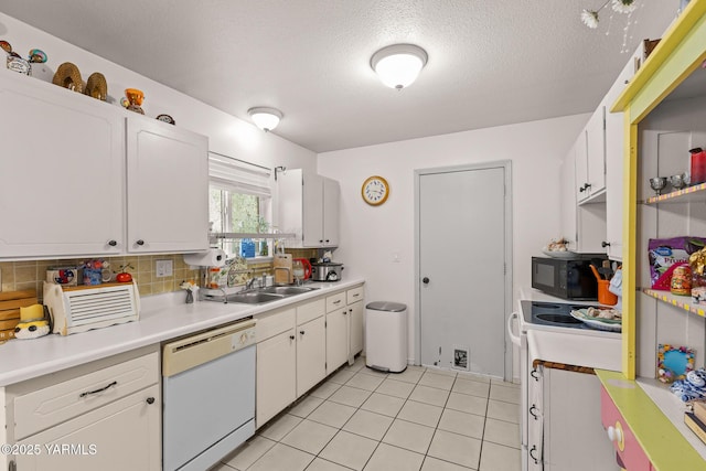 7610 Summitview Ave # 1, Yakima, WA 98908 - kitchen with dishwasher, black microwave, white cabinetry, decorative backsplash, and a textured ceiling