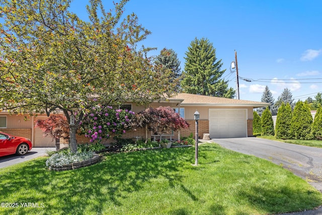 7610 Summitview Ave # 1, Yakima, WA 98908 - view of front of house featuring a garage, driveway, brick siding, and a front yard