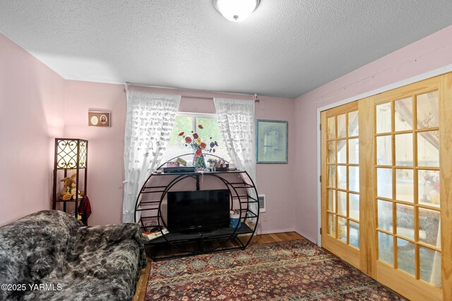 7610 Summitview Ave # 1, Yakima, WA 98908 - living room featuring a textured ceiling and wood finished floors