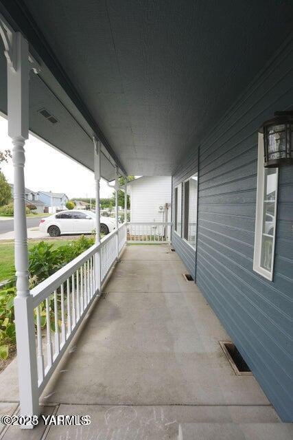 view of patio featuring visible vents and a porch