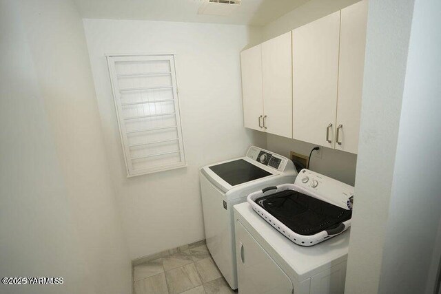 6504 Terry Ave, Yakima, WA 98908 - laundry room featuring washing machine and dryer and cabinet space