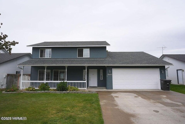 traditional-style home featuring a garage, concrete driveway, a porch, and a front yard