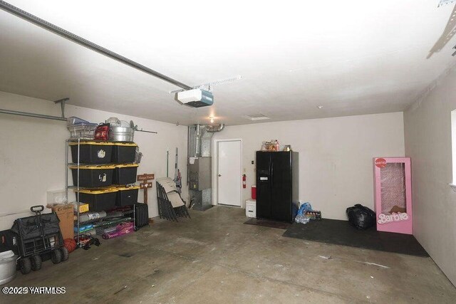 6504 Terry Ave, Yakima, WA 98908 - garage with heating unit and a garage door opener