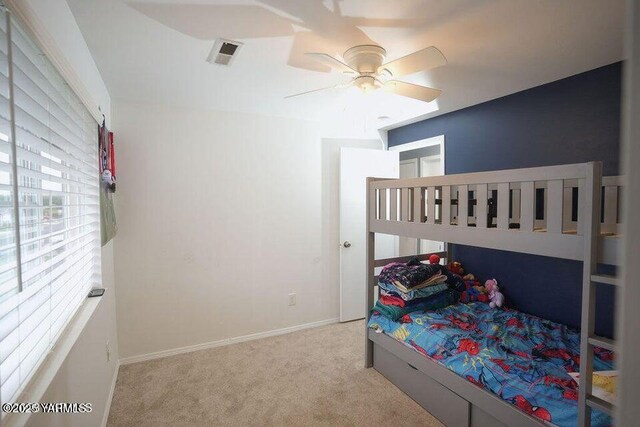 6504 Terry Ave, Yakima, WA 98908 - bedroom with light colored carpet, visible vents, ceiling fan, and baseboards