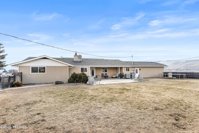 7773 N Wenas Rd, Selah, WA 98942 - back of property with central air condition unit, a chimney, and a patio