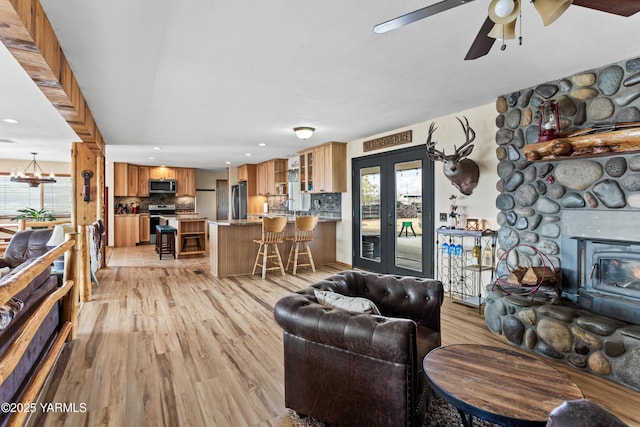 7773 N Wenas Rd, Selah, WA 98942 - living room with light wood-style flooring, a ceiling fan, recessed lighting, and a chandelier