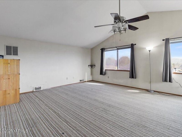 unfurnished room with lofted ceiling, carpet, ceiling fan, and visible vents