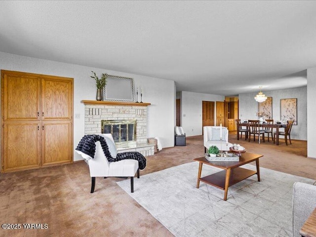 living area featuring a brick fireplace, a chandelier, and light colored carpet