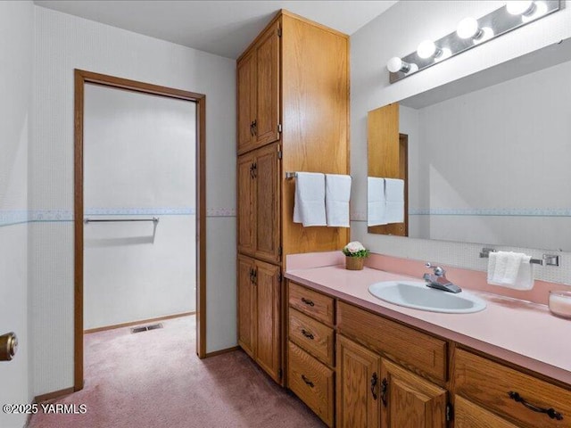 bathroom with visible vents and vanity