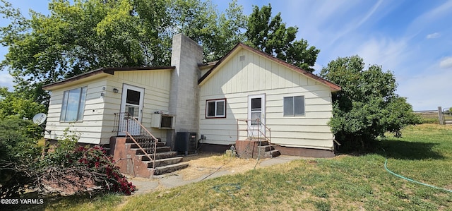1481 Potter Rd, Tieton, WA 98947 - back of property with entry steps, a lawn, and a chimney