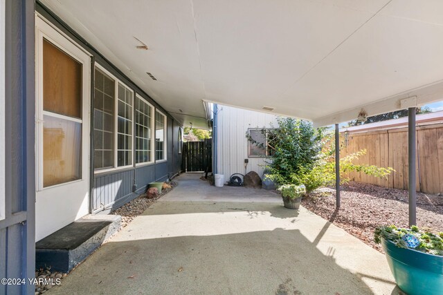 view of patio / terrace featuring fence