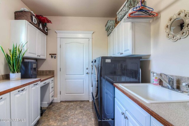 11300 Flintstone Rd, Yakima, WA 98908 - washroom with cabinet space, stone finish floors, and washer and dryer