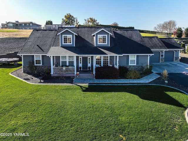 11300 Flintstone Rd, Yakima, WA 98908 - view of front facade with stone siding, a porch, a front yard, concrete driveway, and a garage