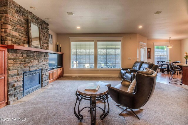 11300 Flintstone Rd, Yakima, WA 98908 - carpeted living area featuring a stone fireplace and recessed lighting