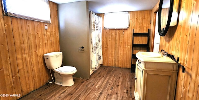 4511 Englewood Ave, Yakima, WA 98908 - bathroom with toilet, wood finished floors, wood walls, vanity, and a shower with curtain