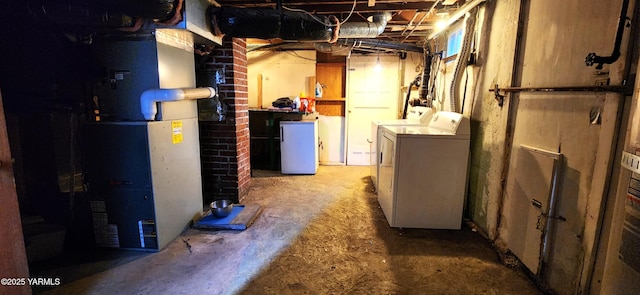 4511 Englewood Ave, Yakima, WA 98908 - unfinished below grade area featuring washing machine and dryer, refrigerator, and heating unit