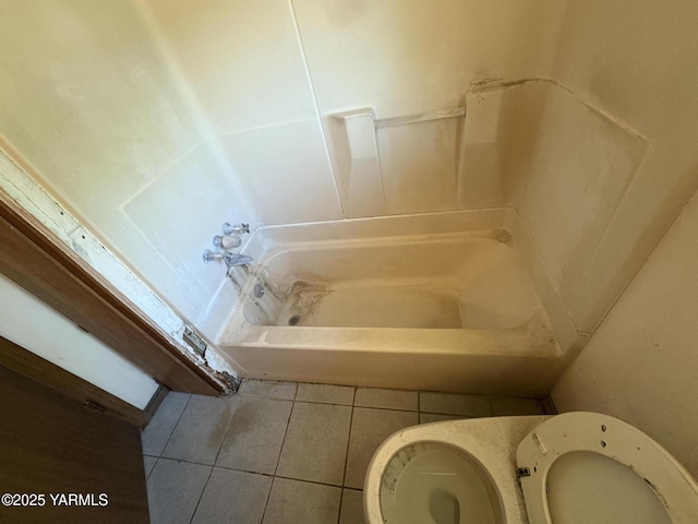 full bath featuring toilet and tile patterned flooring