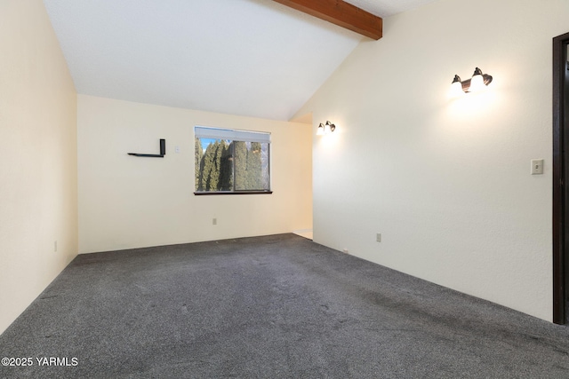 carpeted empty room with lofted ceiling with beams