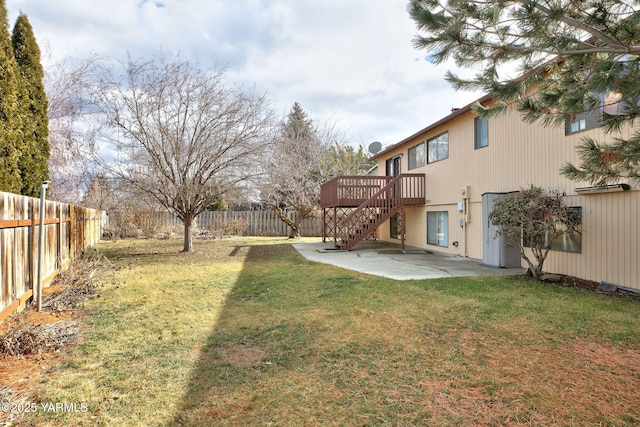 view of yard featuring a fenced backyard, a patio, a deck, and stairs