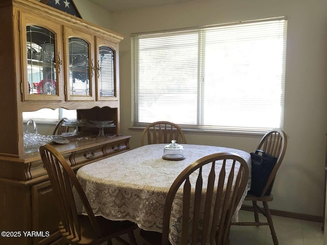 dining area featuring baseboards