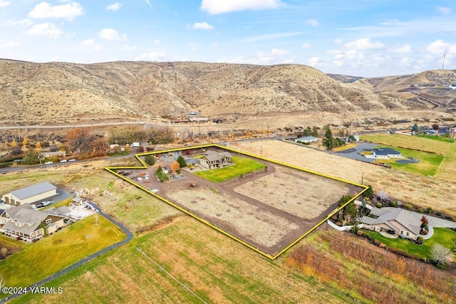 drone / aerial view featuring a residential view and a mountain view