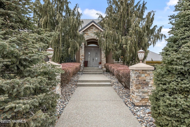 exterior space featuring stone siding