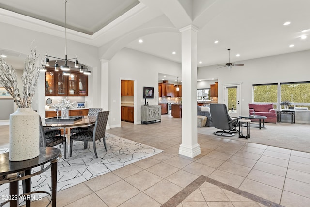 dining room featuring light tile patterned floors, recessed lighting, and ornate columns