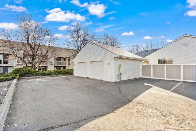 detached garage with fence