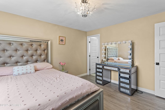 4814 W Viola Ave, Yakima, WA 98908 - bedroom with wood finished floors, baseboards, and a chandelier