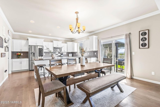 1589 Valhalla Loop, Selah, WA 98942 - dining space featuring a chandelier, light wood-style floors, baseboards, crown molding, and recessed lighting
