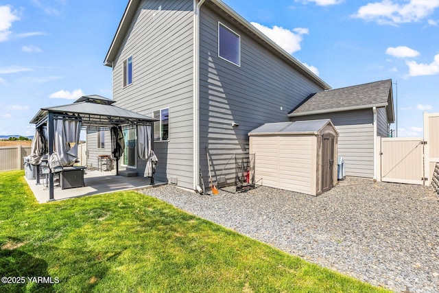 1589 Valhalla Loop, Selah, WA 98942 - back of property with a patio area, a gate, and a gazebo