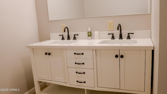 bathroom with double vanity and a sink