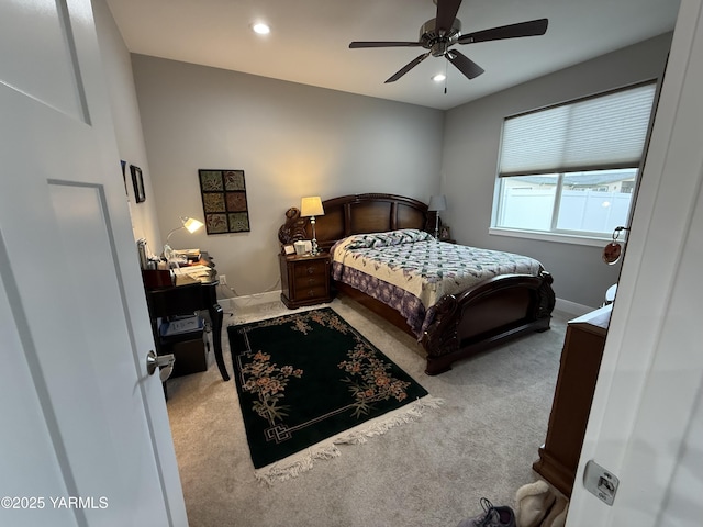 bedroom featuring light carpet, recessed lighting, and baseboards