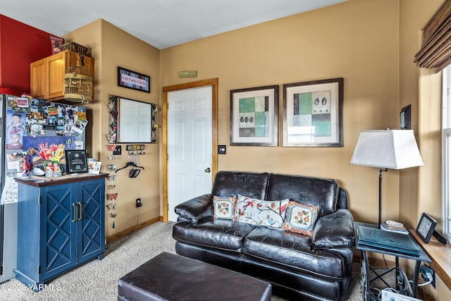 living room with light carpet and baseboards