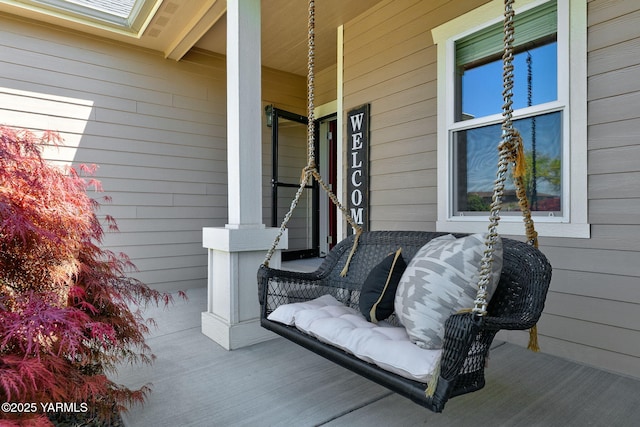 wooden terrace with a porch