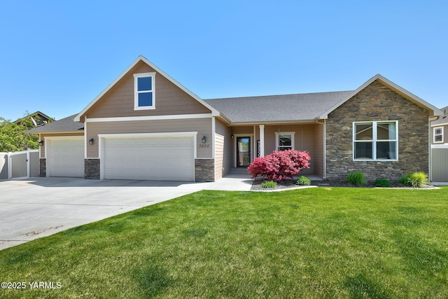 craftsman-style home featuring fence, roof with shingles, a front lawn, stone siding, and driveway